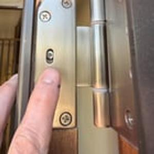 Preview thumbnail for What are these 2 things on an exterior door hinge?