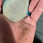 Preview thumbnail for On vacation so I don't have my knapping stuff, but I managed to find a triangular rock and have been working on grinding it on rocks in the river